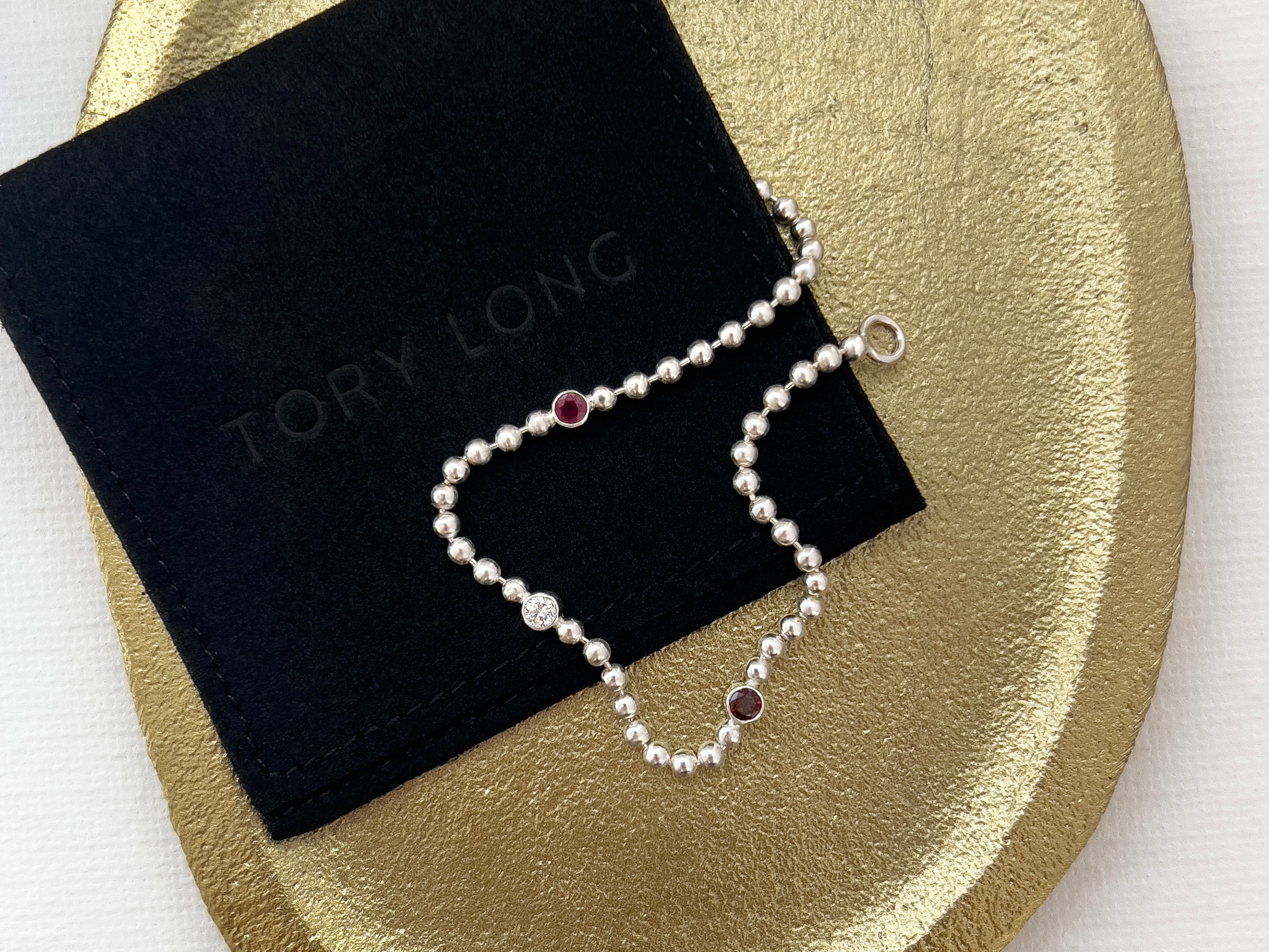 Silver ball chain bracelet with ruby, diamond and garnet on a gold plate