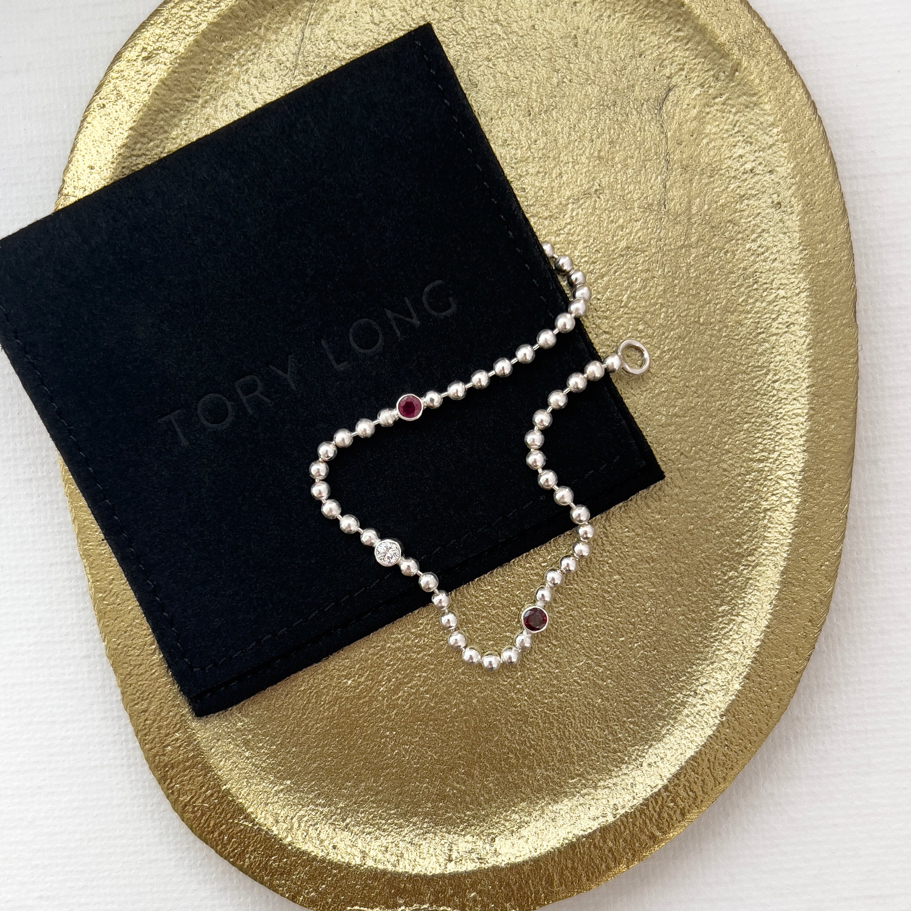 Silver ball chain bracelet with ruby, diamond and garnet on a gold plate