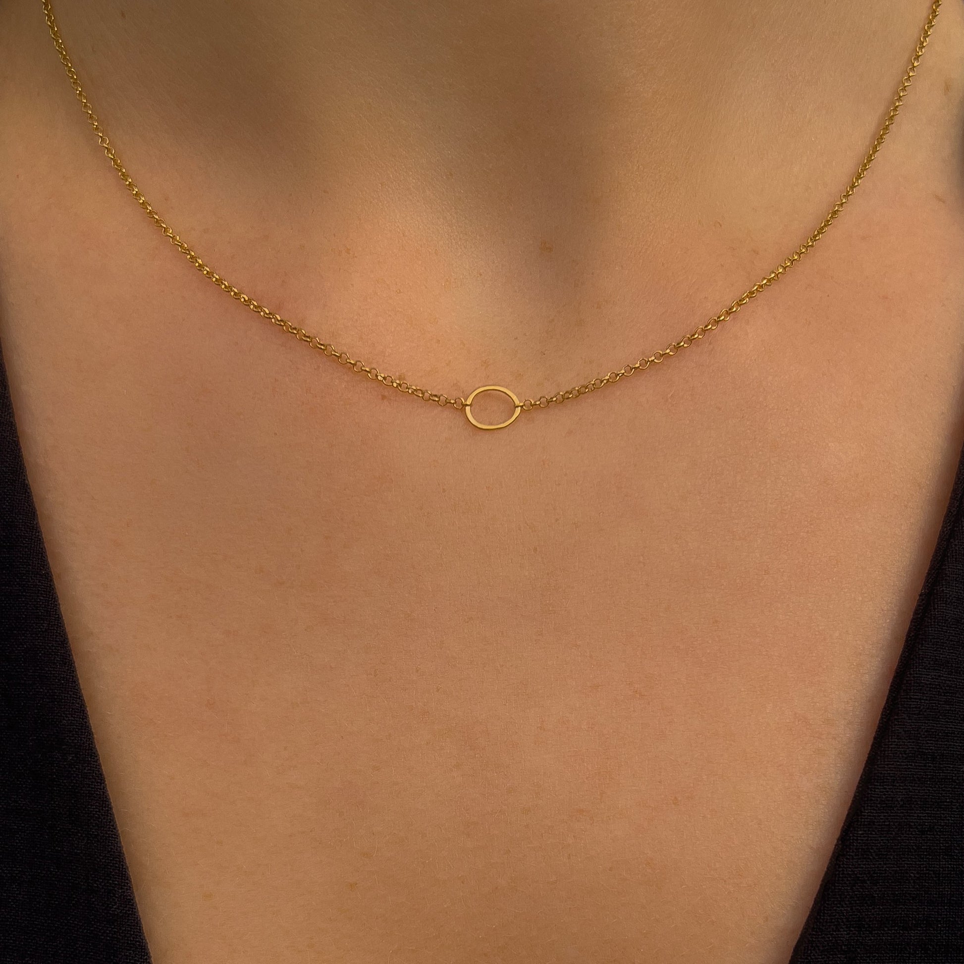 18k gold vermeil belcher chain necklace with a circular shaped pendant. 