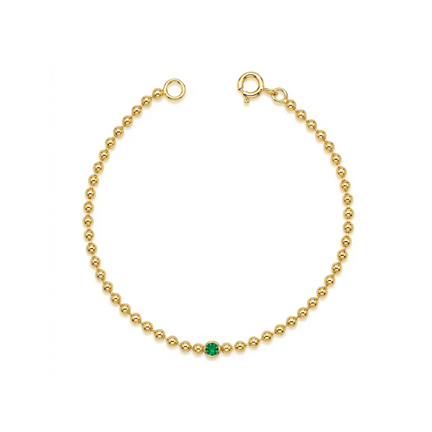 Gold ball chain bracelet with a green emerald on a white background