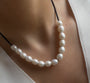 White large pearl necklace on black chain
